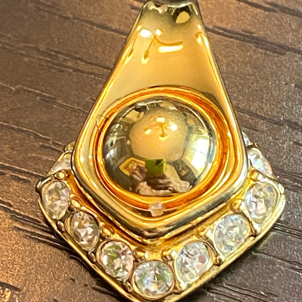 Gold tone and clear rhinestone Joan Rivers pendant
